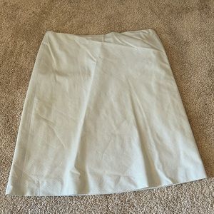 J. Crew brand, mini/pencil tan skirt with blue stripes and zipper.